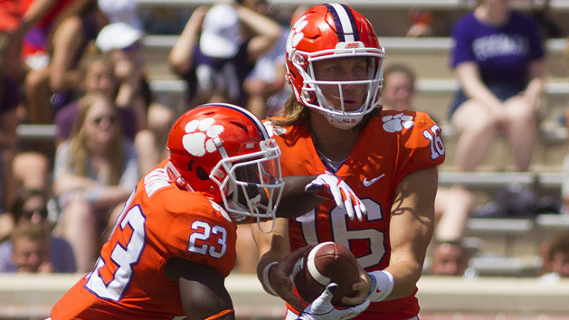 Sep 1, 2018; Clemson, SC, USA; Clemson Tigers quarterback Trevor Lawrence (16) hands the ball off to Clemson Tigers running back Lyn-J Dixon (23) during the third quarter at Clemson Memorial Stadium. Photo Credit: Joshua S. Kelly-USA TODAY Sports