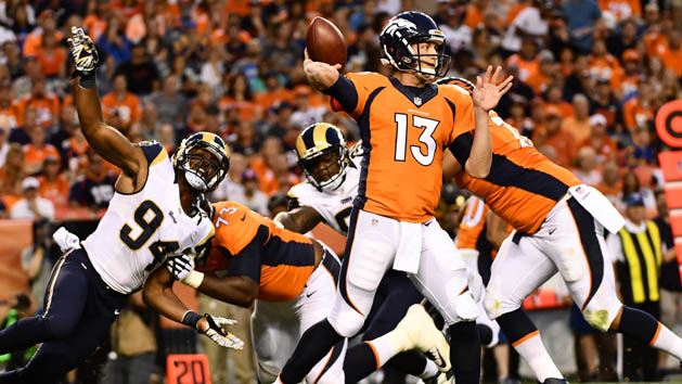 Aug 27, 2016; Denver, CO, USA; Los Angeles Rams defensive end Robert Quinn (94) pressures Denver Broncos quarterback Trevor Siemian (13) during the first quarter against of a preseason game at Sports Authority Field at Mile High. Photo Credit: Ron Chenoy-USA TODAY Sports