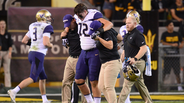 Oct 14, 2017; Tempe, AZ, USA; Washington Huskies offensive lineman Trey Adams (72) is helped off the field after being injured against the Arizona State Sun Devils during the first half at Sun Devil Stadium. Photo Credit: Joe Camporeale-USA TODAY Sports