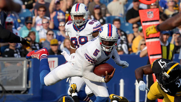Tyrod Taylor (5) avoids a tackle by Pittsburgh Steelers inside linebacker Terence Garvin (57) and runs the ball in for a touchdown during the second half at Ralph Wilson Stadium. Bills beat the Steelers 43 to 19. (Timothy T. Ludwig-USA TODAY Sports)