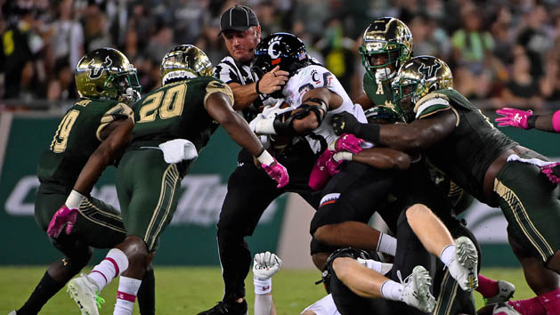 Oct 14, 2017; Tampa, FL, USA; Cincinnati Bearcats running back Gerrid Doaks (23) runs into umpire Paul Myers in the game against the South Florida Bulls during the first half at Raymond James Stadium. Photo Credit: Jasen Vinlove-USA TODAY Sports