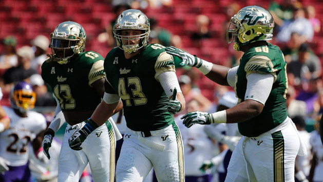 Oct 8, 2016; Tampa, FL, USA; South Florida Bulls linebacker Auggie Sanchez (43) is congratulated after he made a stop against the East Carolina Pirates during the first quarter at Raymond James Stadium. Photo Credit: Kim Klement-USA TODAY Sports