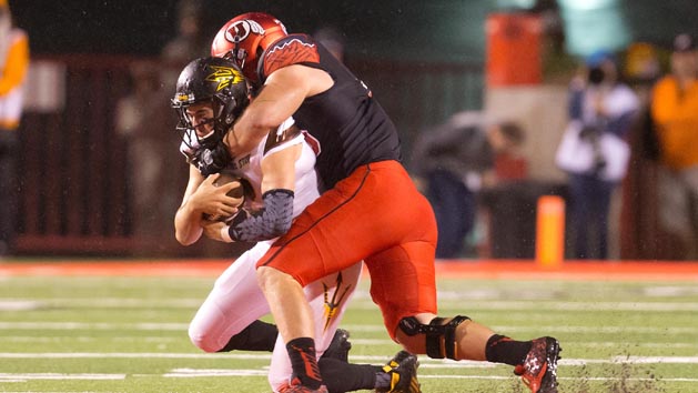 Oct 17, 2015; Salt Lake City, UT, USA; Utah Utes defensive end Hunter Dimick (49) tackles Arizona State Sun Devils quarterback Mike Bercovici (2) during the first half at Rice-Eccles Stadium. Mandatory Credit: Russ Isabella-USA TODAY Sports