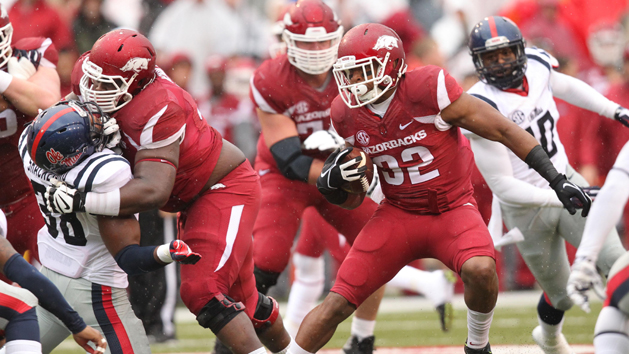 Nov 22, 2014; Fayetteville, AR, USA; Arkansas Razorbacks running back Jonathan Williams (32) rushes against the Ole Miss Rebels at Donald W. Reynolds Razorback Stadium. Arkansas defeated Mississippi 30-0. (Nelson Chenault-USA TODAY Sports)